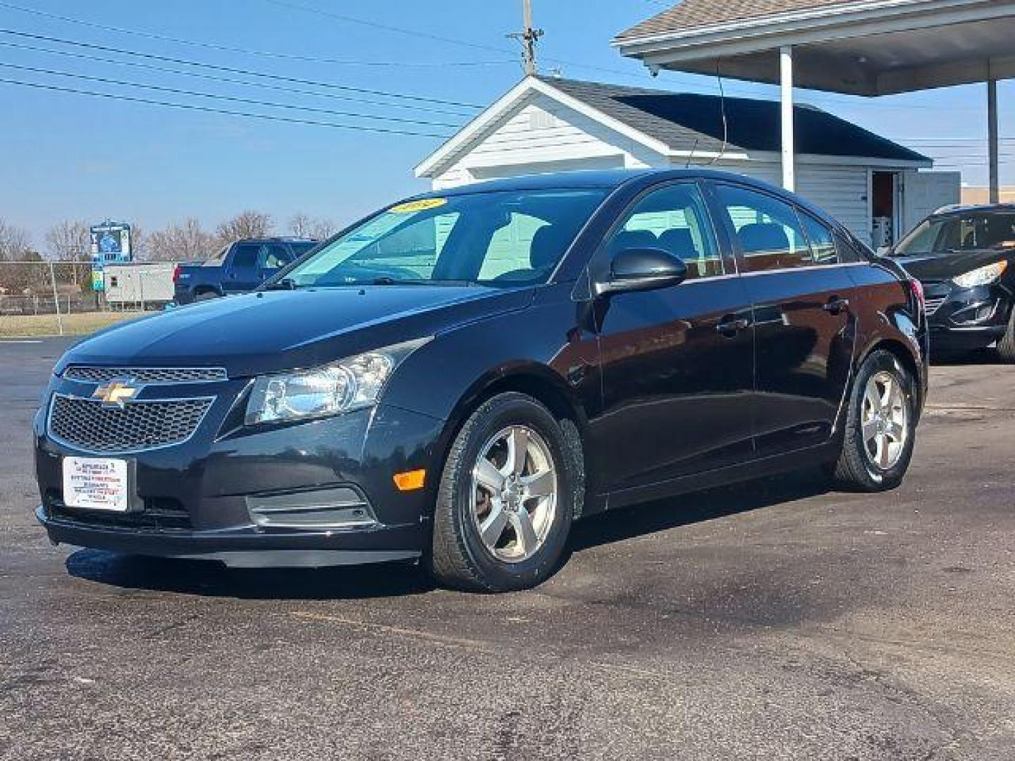 2014 Black Granite Metallic Chevrolet Cruze 1LT Auto (1G1PC5SB2E7) with an 1.4L L4 DOHC 16V TURBO engine, 6-Speed Automatic transmission, located at 4508 South Dixie Dr, Moraine, OH, 45439, (937) 908-9800, 39.689976, -84.218452 - Photo#2