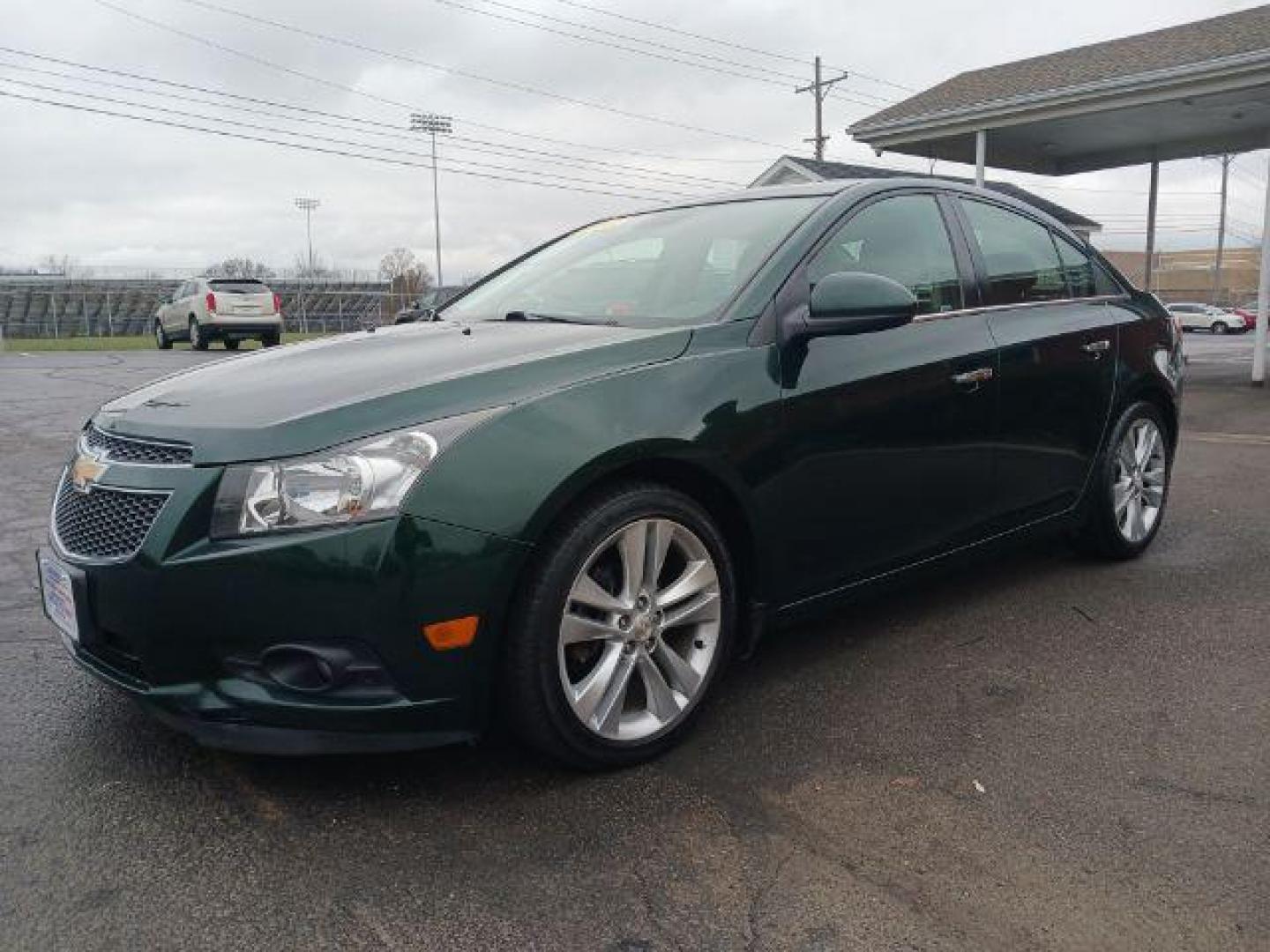 2014 Rainforest Green Metallic Chevrolet Cruze LTZ Auto (1G1PG5SB9E7) with an 1.4L L4 DOHC 16V TURBO engine, 6-Speed Automatic transmission, located at 1099 N County Rd 25A , Troy, OH, 45373, (937) 908-9800, 40.057079, -84.212883 - Photo#2