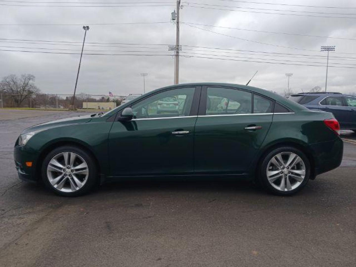 2014 Rainforest Green Metallic Chevrolet Cruze LTZ Auto (1G1PG5SB9E7) with an 1.4L L4 DOHC 16V TURBO engine, 6-Speed Automatic transmission, located at 1099 N County Rd 25A , Troy, OH, 45373, (937) 908-9800, 40.057079, -84.212883 - Photo#3