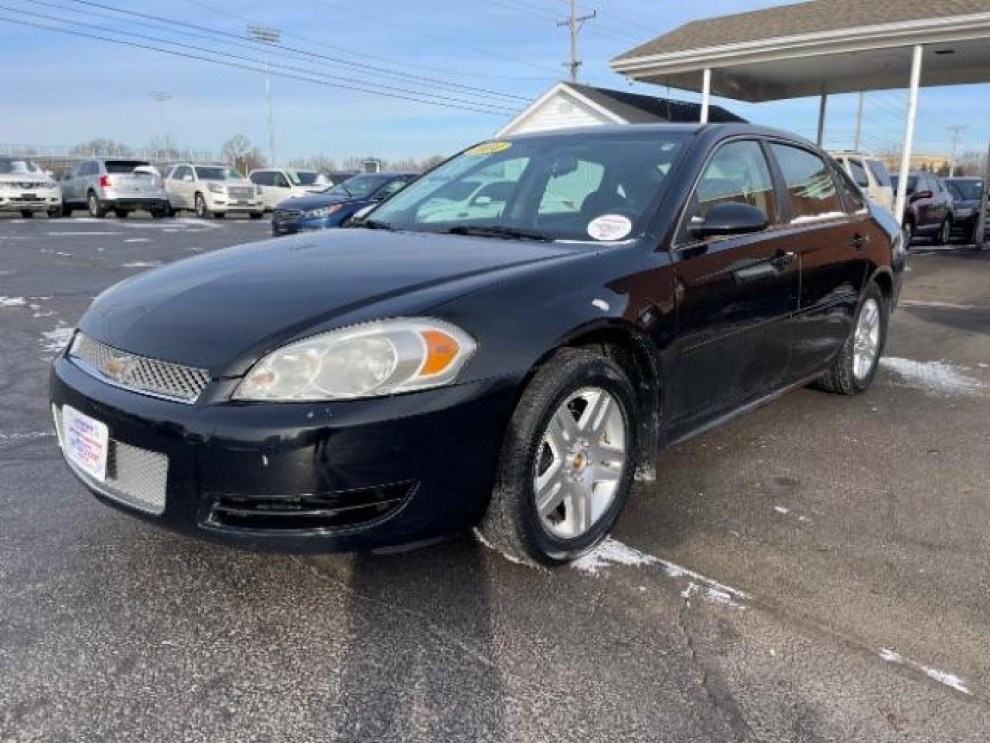 2014 Black Chevrolet Impala Limited LT (2G1WB5E37E1) with an 3.6L V6 DOHC 16V FFV engine, 6-Speed Automatic transmission, located at 1099 N County Rd 25A , Troy, OH, 45373, (937) 908-9800, 40.057079, -84.212883 - Photo#1