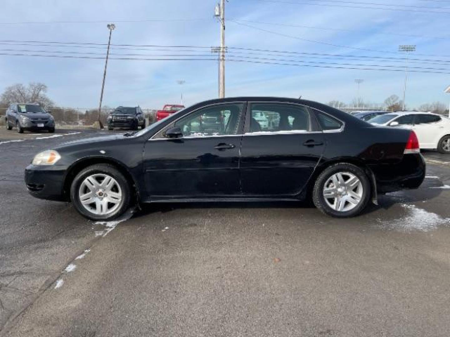 2014 Black Chevrolet Impala Limited LT (2G1WB5E37E1) with an 3.6L V6 DOHC 16V FFV engine, 6-Speed Automatic transmission, located at 1099 N County Rd 25A , Troy, OH, 45373, (937) 908-9800, 40.057079, -84.212883 - Photo#2