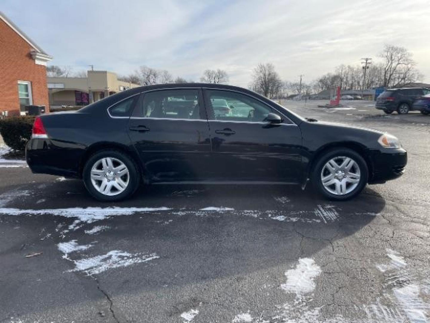 2014 Black Chevrolet Impala Limited LT (2G1WB5E37E1) with an 3.6L V6 DOHC 16V FFV engine, 6-Speed Automatic transmission, located at 1099 N County Rd 25A , Troy, OH, 45373, (937) 908-9800, 40.057079, -84.212883 - Photo#3