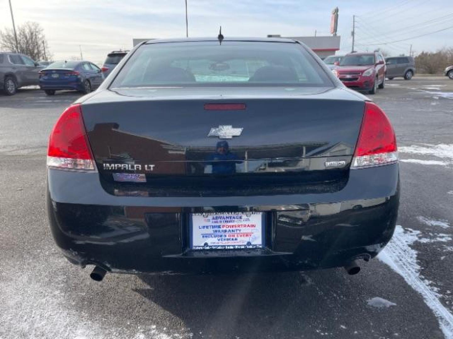 2014 Black Chevrolet Impala Limited LT (2G1WB5E37E1) with an 3.6L V6 DOHC 16V FFV engine, 6-Speed Automatic transmission, located at 1099 N County Rd 25A , Troy, OH, 45373, (937) 908-9800, 40.057079, -84.212883 - Photo#4