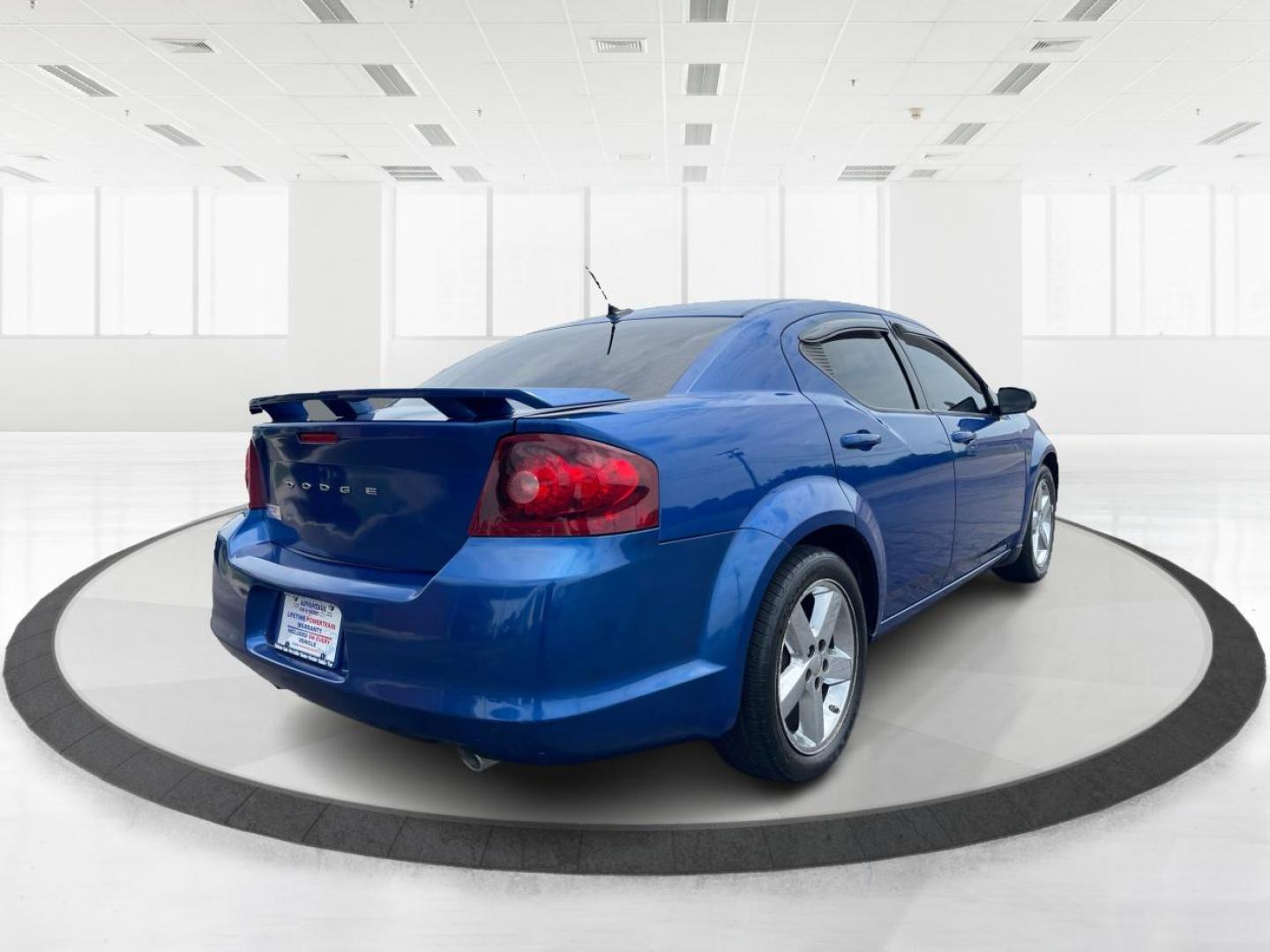 2014 Blue Streak Pearlcoat Dodge Avenger SE (1C3CDZAG1EN) with an 3.6L V6 DOHC 24V FFV engine, 6-Speed Automatic transmission, located at 1099 N County Rd 25A , Troy, OH, 45373, (937) 908-9800, 40.057079, -84.212883 - Photo#2