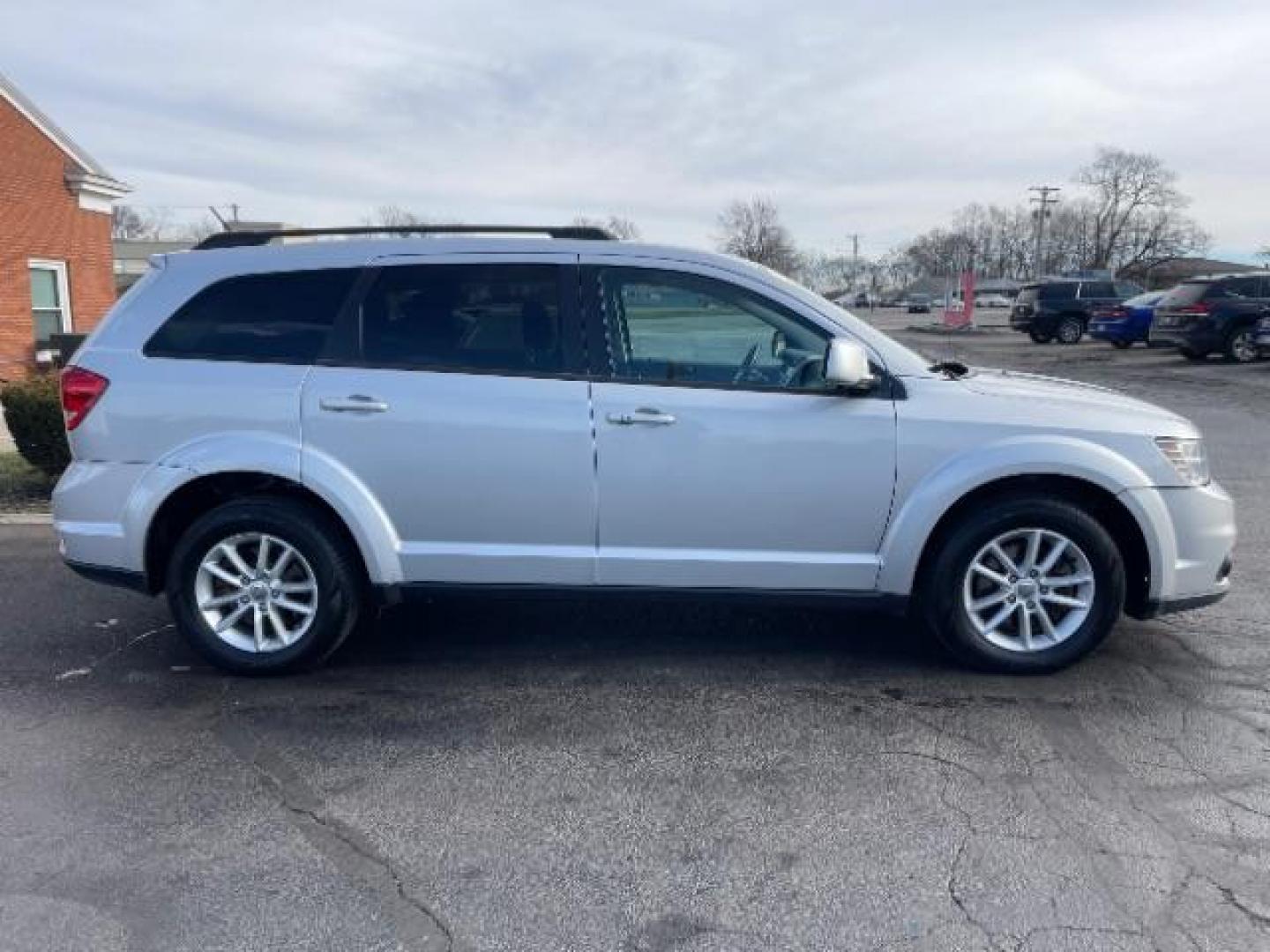 2014 Bright Silver Metallic CC Dodge Journey SXT (3C4PDCBG0ET) with an 3.6L V6 DOHC 24V engine, 6-Speed Automatic transmission, located at 401 Woodman Dr, Riverside, OH, 45431, (937) 908-9800, 39.760899, -84.123421 - Photo#3