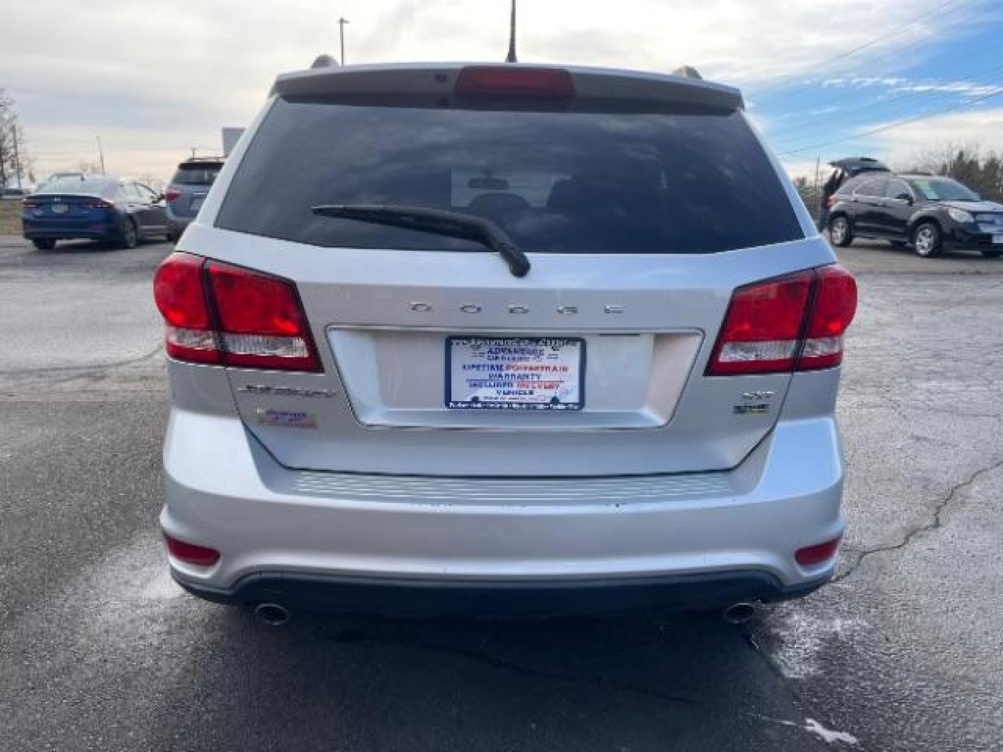 2014 Bright Silver Metallic CC Dodge Journey SXT (3C4PDCBG0ET) with an 3.6L V6 DOHC 24V engine, 6-Speed Automatic transmission, located at 401 Woodman Dr, Riverside, OH, 45431, (937) 908-9800, 39.760899, -84.123421 - Photo#4