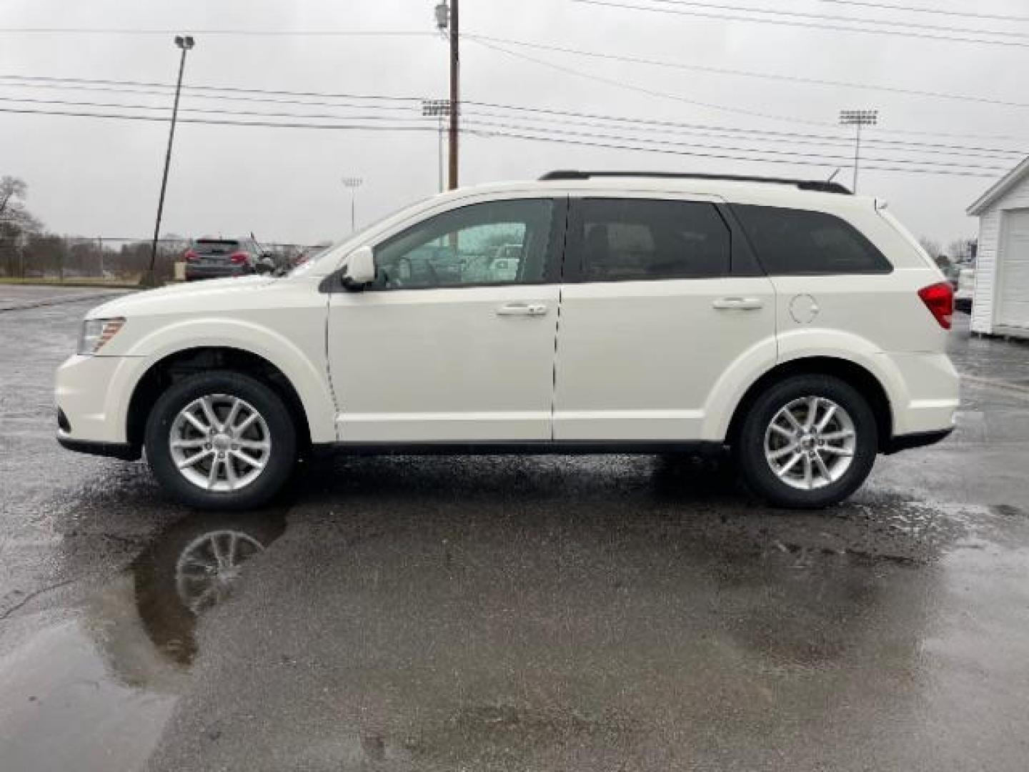 2014 Pearl White Tri-Coat Dodge Journey SXT (3C4PDCBG0ET) with an 3.6L V6 DOHC 24V engine, 6-Speed Automatic transmission, located at 4508 South Dixie Dr, Moraine, OH, 45439, (937) 908-9800, 39.689976, -84.218452 - Photo#2