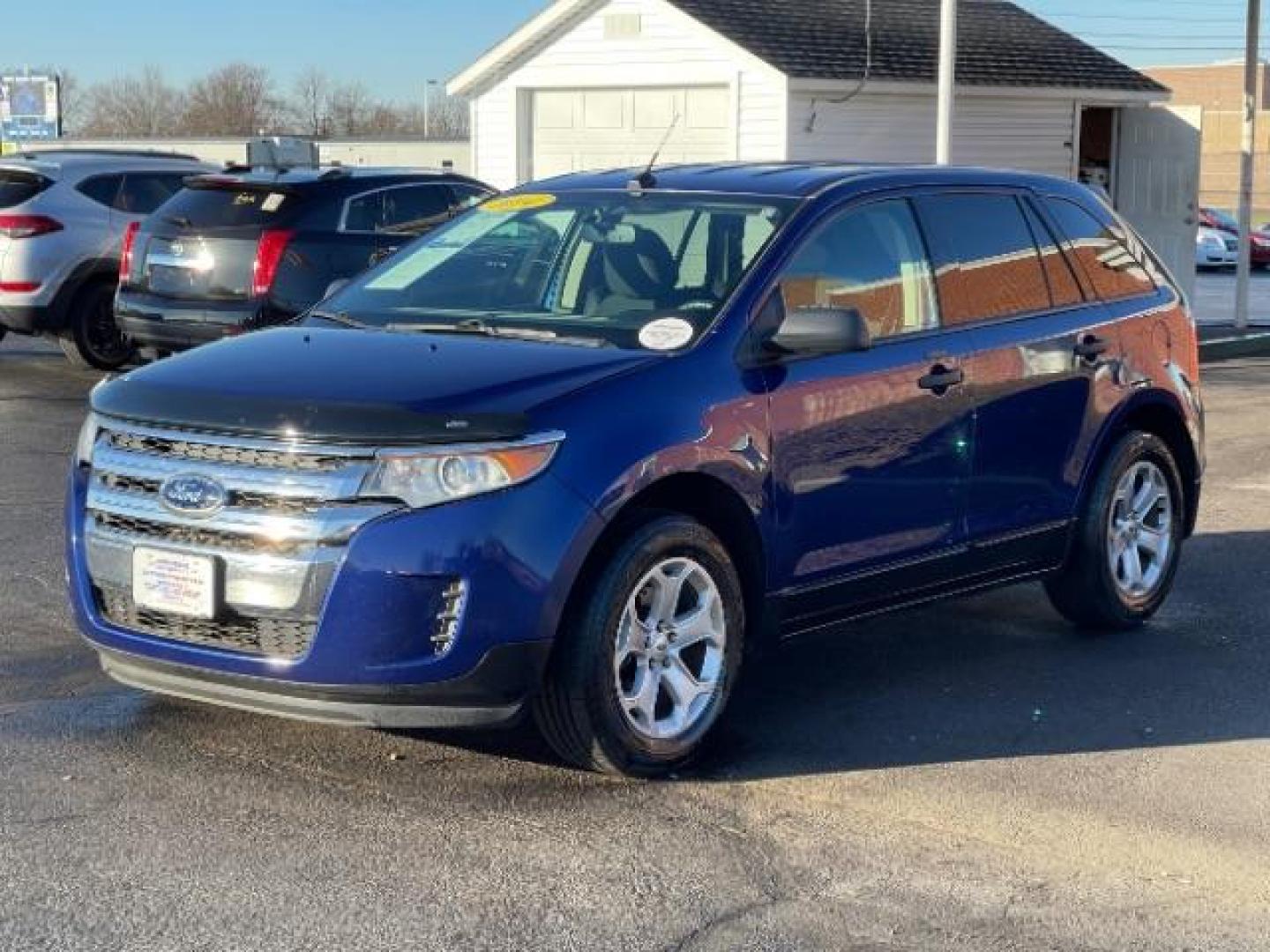 2014 Deep Impact Blue Metallic Ford Edge SE FWD (2FMDK3G93EB) with an 2.0L L4 DOHC 16V engine, 6-Speed Automatic transmission, located at 880 E. National Road, Vandalia, OH, 45377, (937) 908-9800, 39.891918, -84.183594 - Photo#1