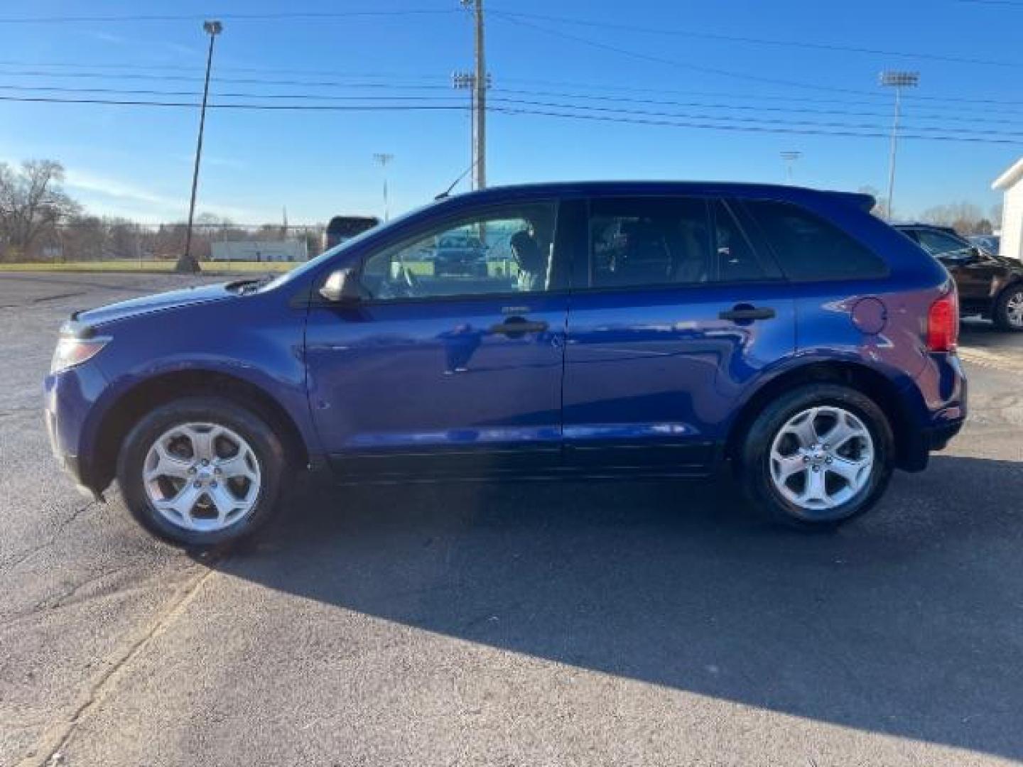 2014 Deep Impact Blue Metallic Ford Edge SE FWD (2FMDK3G93EB) with an 2.0L L4 DOHC 16V engine, 6-Speed Automatic transmission, located at 880 E. National Road, Vandalia, OH, 45377, (937) 908-9800, 39.891918, -84.183594 - Photo#2