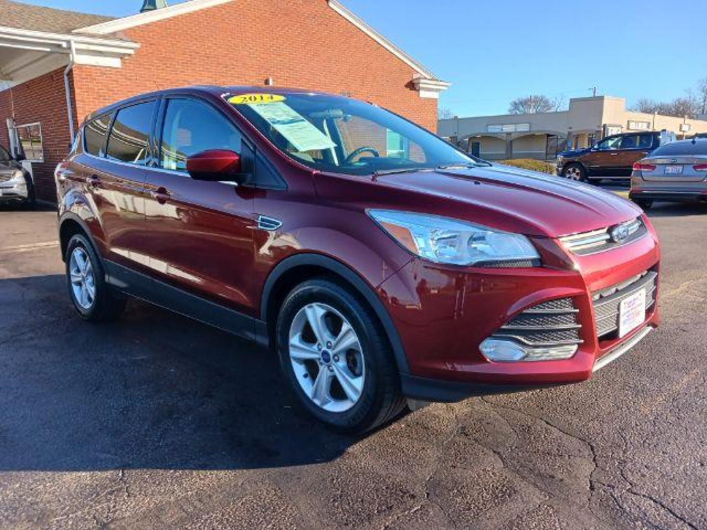 2014 Ruby Red Tinted CC Ford Escape SE FWD (1FMCU0G93EU) with an 2.0L L4 DOHC 16V engine, 6-Speed Automatic transmission, located at 401 Woodman Dr, Riverside, OH, 45431, (937) 908-9800, 39.760899, -84.123421 - Photo#0