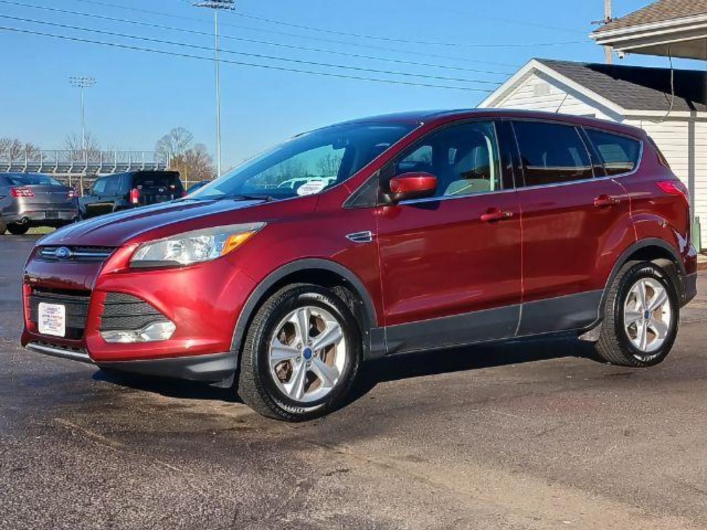 2014 Ruby Red Tinted CC Ford Escape SE FWD (1FMCU0G93EU) with an 2.0L L4 DOHC 16V engine, 6-Speed Automatic transmission, located at 401 Woodman Dr, Riverside, OH, 45431, (937) 908-9800, 39.760899, -84.123421 - Photo#2