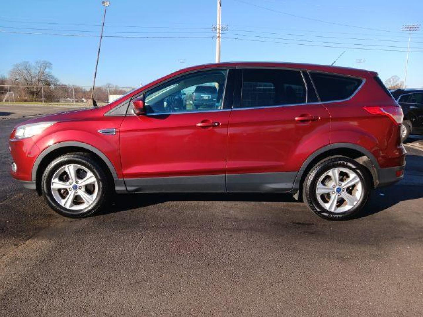 2014 Ruby Red Tinted CC Ford Escape SE FWD (1FMCU0G93EU) with an 2.0L L4 DOHC 16V engine, 6-Speed Automatic transmission, located at 401 Woodman Dr, Riverside, OH, 45431, (937) 908-9800, 39.760899, -84.123421 - Photo#3