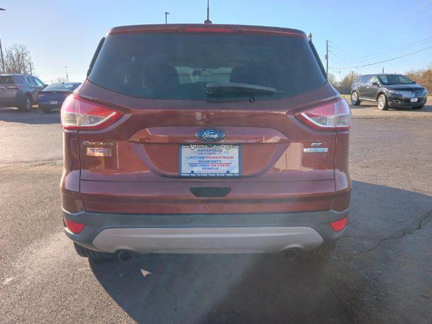 2014 Ruby Red Tinted CC Ford Escape SE FWD (1FMCU0G93EU) with an 2.0L L4 DOHC 16V engine, 6-Speed Automatic transmission, located at 401 Woodman Dr, Riverside, OH, 45431, (937) 908-9800, 39.760899, -84.123421 - Photo#5