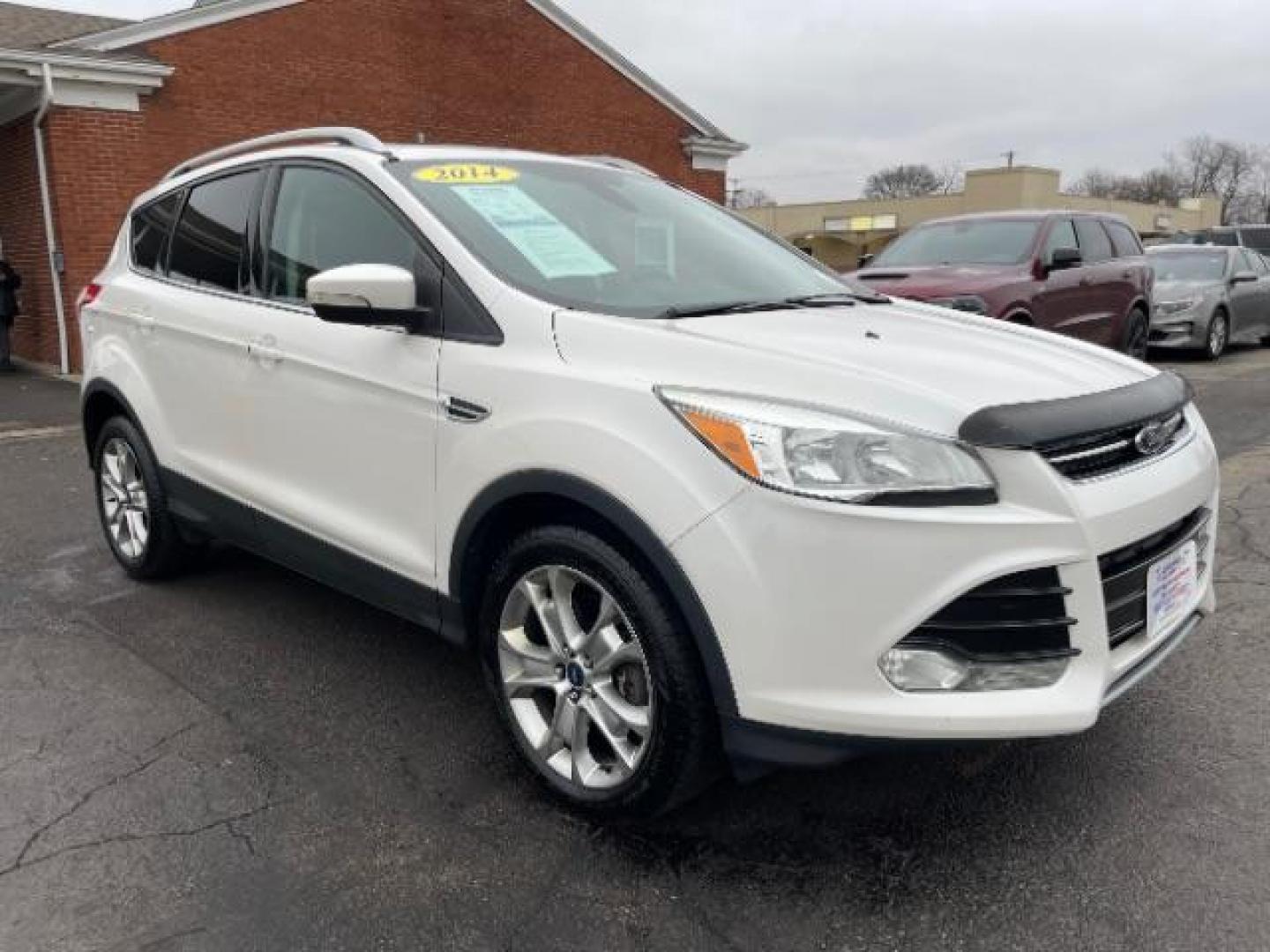 2014 White Platinum Tricoat Ford Escape Titanium 4WD (1FMCU9J95EU) with an 2.0L L4 DOHC 16V engine, 6-Speed Automatic transmission, located at 1184 Kauffman Ave, Fairborn, OH, 45324, (937) 908-9800, 39.807072, -84.030914 - Photo#0