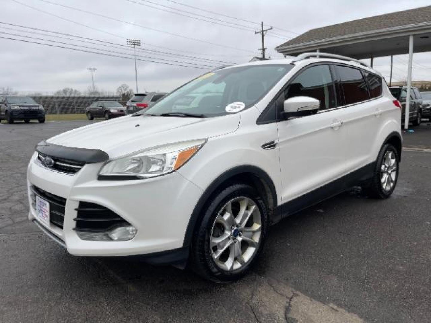 2014 White Platinum Tricoat Ford Escape Titanium 4WD (1FMCU9J95EU) with an 2.0L L4 DOHC 16V engine, 6-Speed Automatic transmission, located at 1184 Kauffman Ave, Fairborn, OH, 45324, (937) 908-9800, 39.807072, -84.030914 - Photo#1