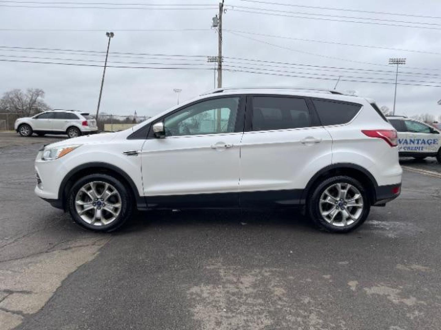 2014 White Platinum Tricoat Ford Escape Titanium 4WD (1FMCU9J95EU) with an 2.0L L4 DOHC 16V engine, 6-Speed Automatic transmission, located at 1184 Kauffman Ave, Fairborn, OH, 45324, (937) 908-9800, 39.807072, -84.030914 - Photo#4