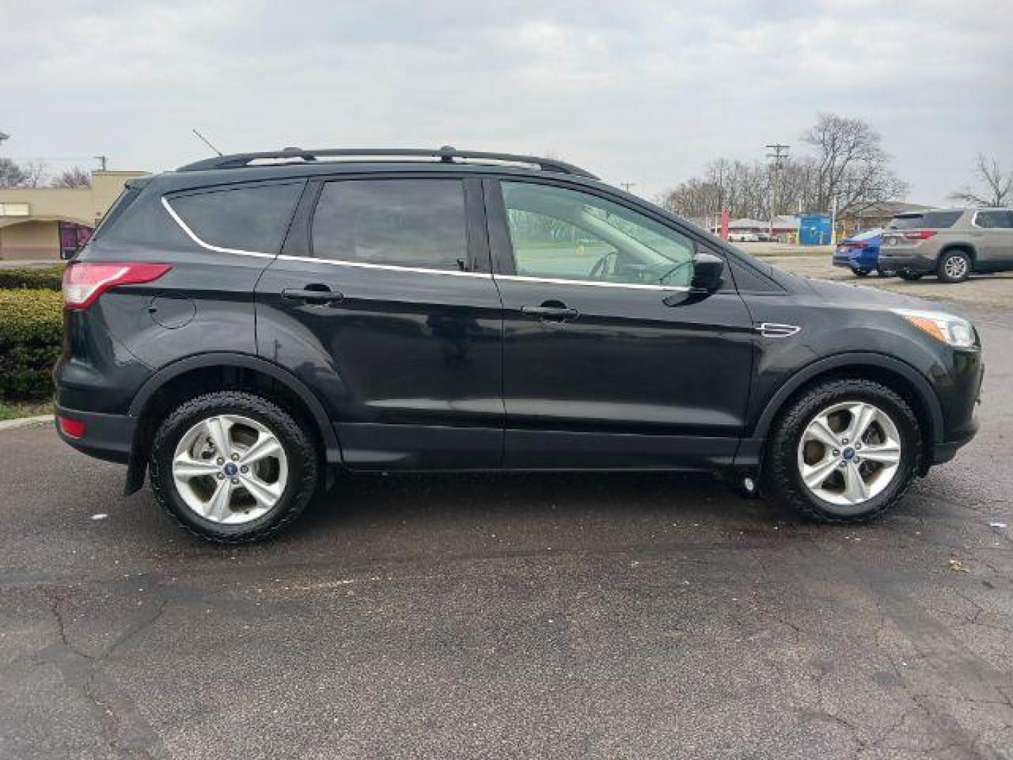 2014 Tuxedo Black Ford Escape SE 4WD (1FMCU9G99EU) with an 2.0L L4 DOHC 16V engine, 6-Speed Automatic transmission, located at 4508 South Dixie Dr, Moraine, OH, 45439, (937) 908-9800, 39.689976, -84.218452 - Photo#4