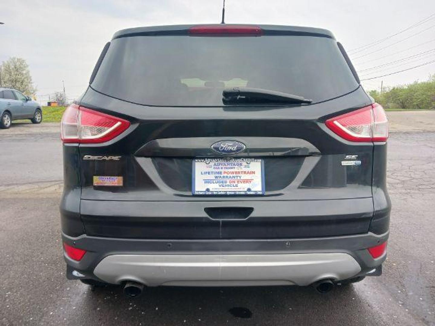 2014 Tuxedo Black Ford Escape SE 4WD (1FMCU9G99EU) with an 2.0L L4 DOHC 16V engine, 6-Speed Automatic transmission, located at 4508 South Dixie Dr, Moraine, OH, 45439, (937) 908-9800, 39.689976, -84.218452 - Photo#5