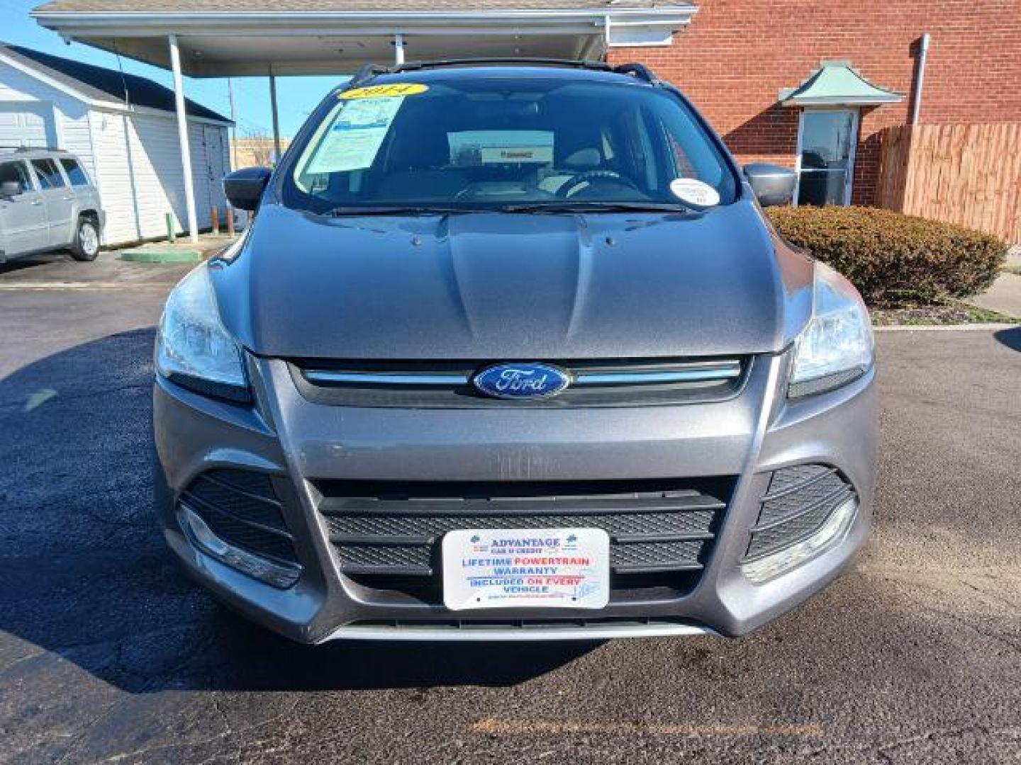 2014 Sterling Gray Metallic Ford Escape SE 4WD (1FMCU9G98EU) with an 2.0L L4 DOHC 16V engine, 6-Speed Automatic transmission, located at 401 Woodman Dr, Riverside, OH, 45431, (937) 908-9800, 39.760899, -84.123421 - Photo#1