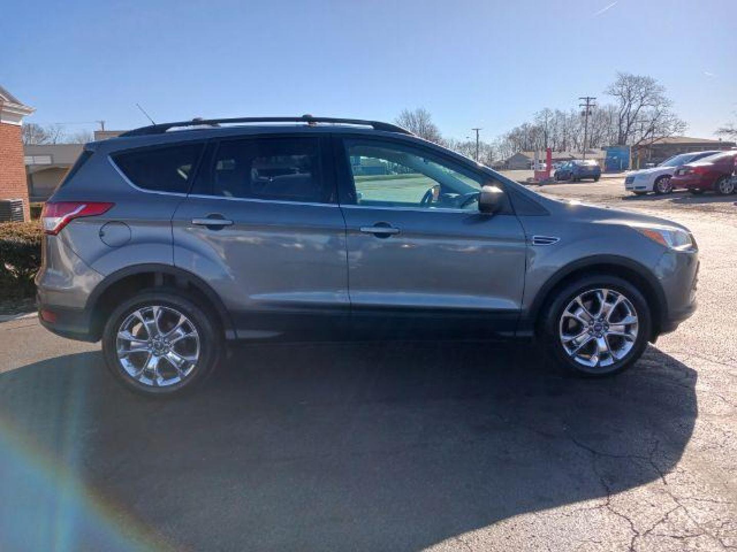 2014 Sterling Gray Metallic Ford Escape SE 4WD (1FMCU9G98EU) with an 2.0L L4 DOHC 16V engine, 6-Speed Automatic transmission, located at 401 Woodman Dr, Riverside, OH, 45431, (937) 908-9800, 39.760899, -84.123421 - Photo#4