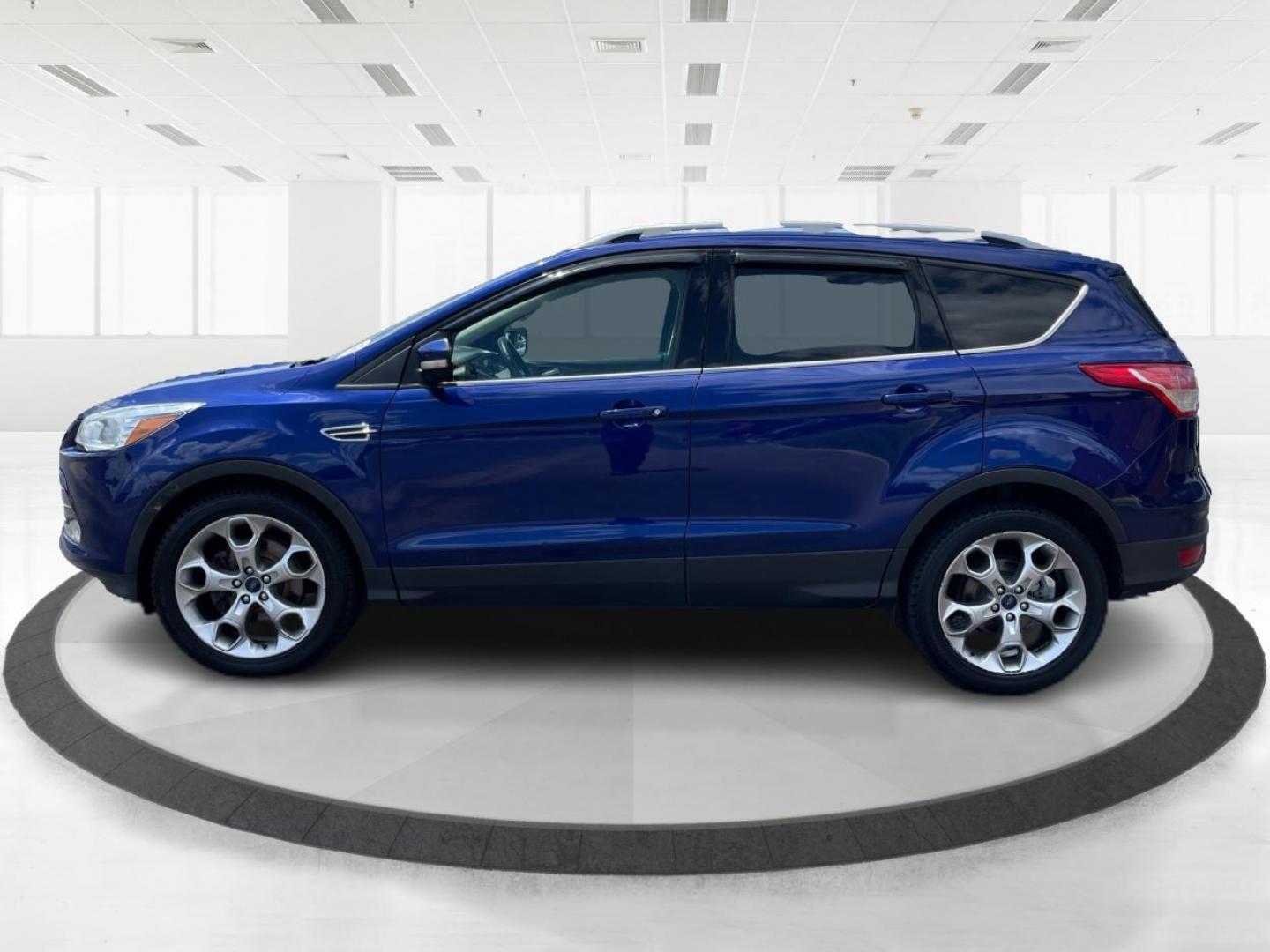 2014 Deep Impact Blue Ford Escape Titanium 4WD (1FMCU9J91EU) with an 2.0L L4 DOHC 16V engine, 6-Speed Automatic transmission, located at 401 Woodman Dr, Riverside, OH, 45431, (937) 908-9800, 39.760899, -84.123421 - Photo#5