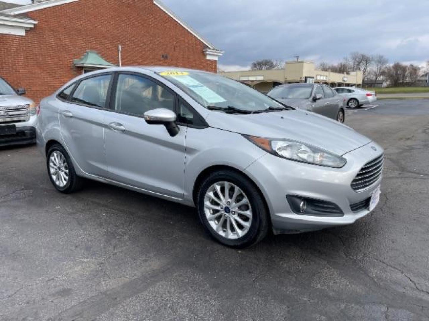 2014 Ingot Silver Metallic Ford Fiesta SE Sedan (3FADP4BJ6EM) with an 1.6L L4 DOHC 16V engine, located at 401 Woodman Dr, Riverside, OH, 45431, (937) 908-9800, 39.760899, -84.123421 - Photo#0