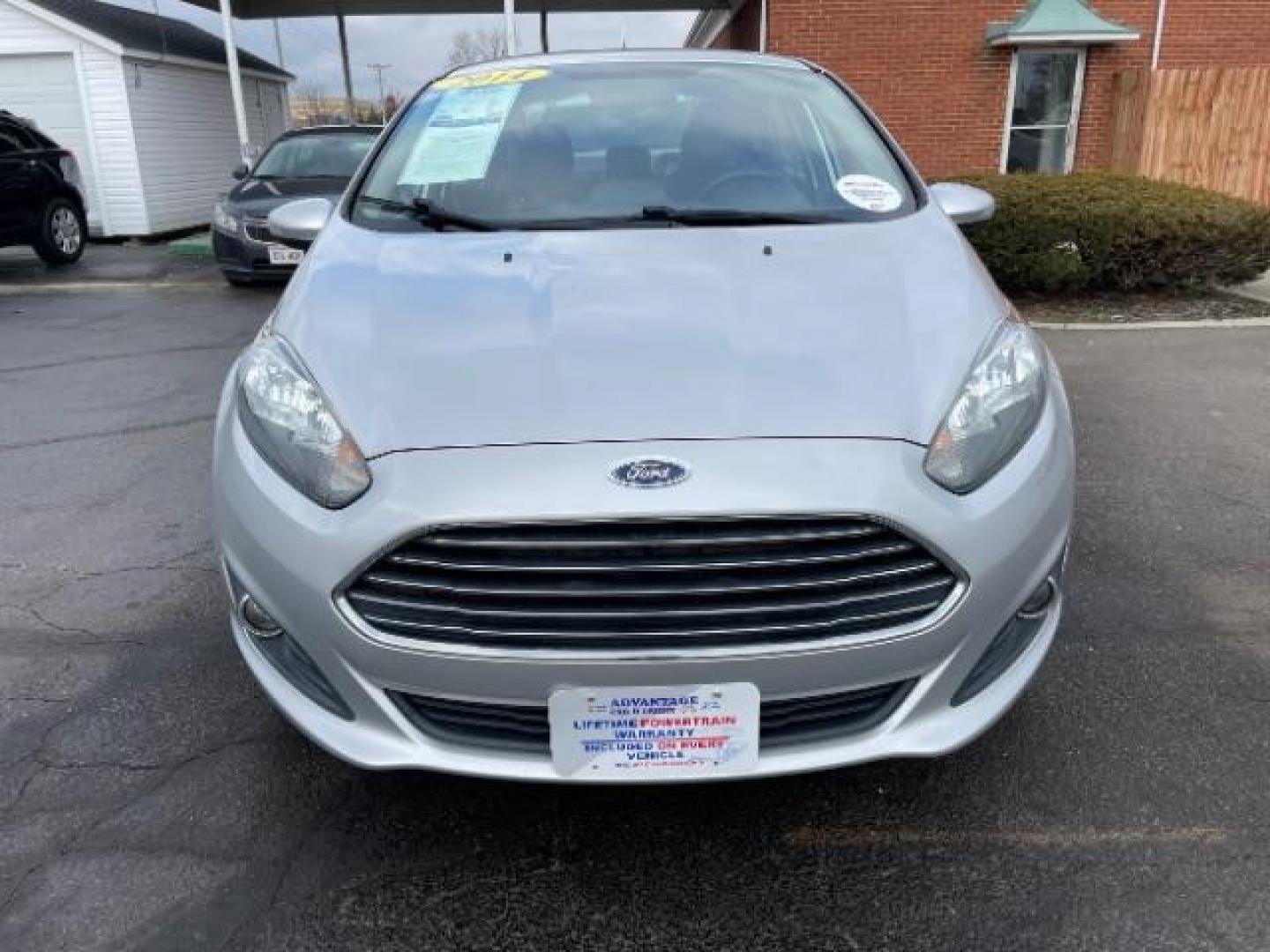 2014 Ingot Silver Metallic Ford Fiesta SE Sedan (3FADP4BJ6EM) with an 1.6L L4 DOHC 16V engine, located at 401 Woodman Dr, Riverside, OH, 45431, (937) 908-9800, 39.760899, -84.123421 - Photo#2