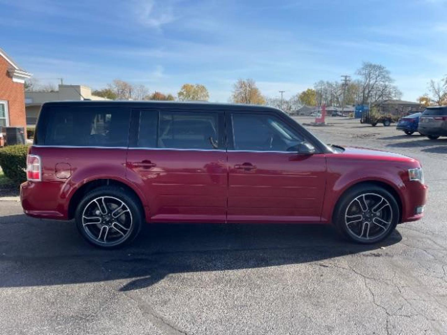 2014 Ruby Red Met Tinted CC Ford Flex SEL AWD (2FMHK6C86EB) with an 3.5L V6 DOHC 24V engine, 6-Speed Automatic Overdrive transmission, located at 4508 South Dixie Dr, Moraine, OH, 45439, (937) 908-9800, 39.689976, -84.218452 - Photo#5