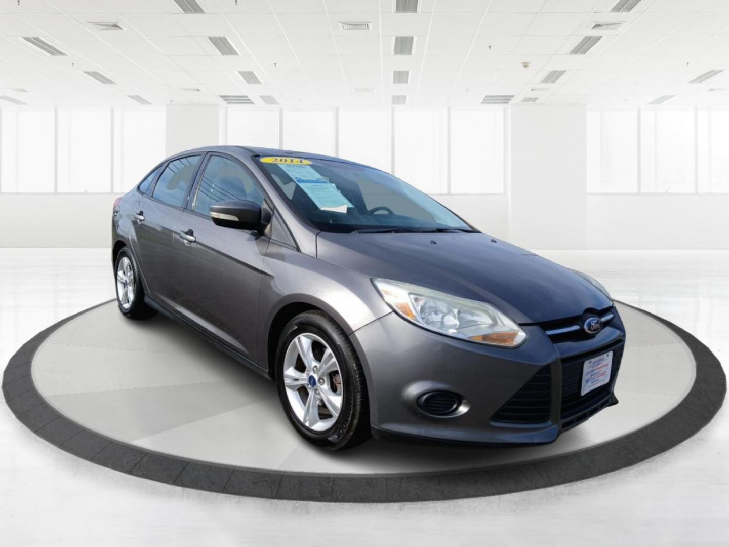 2014 Ingot Silver Metallic Ford Focus SE Sedan (1FADP3F22EL) with an 2.0L L4 DOHC 16V engine, located at 1230 East Main St, Xenia, OH, 45385, (937) 908-9800, 39.688026, -83.910172 - Photo#0