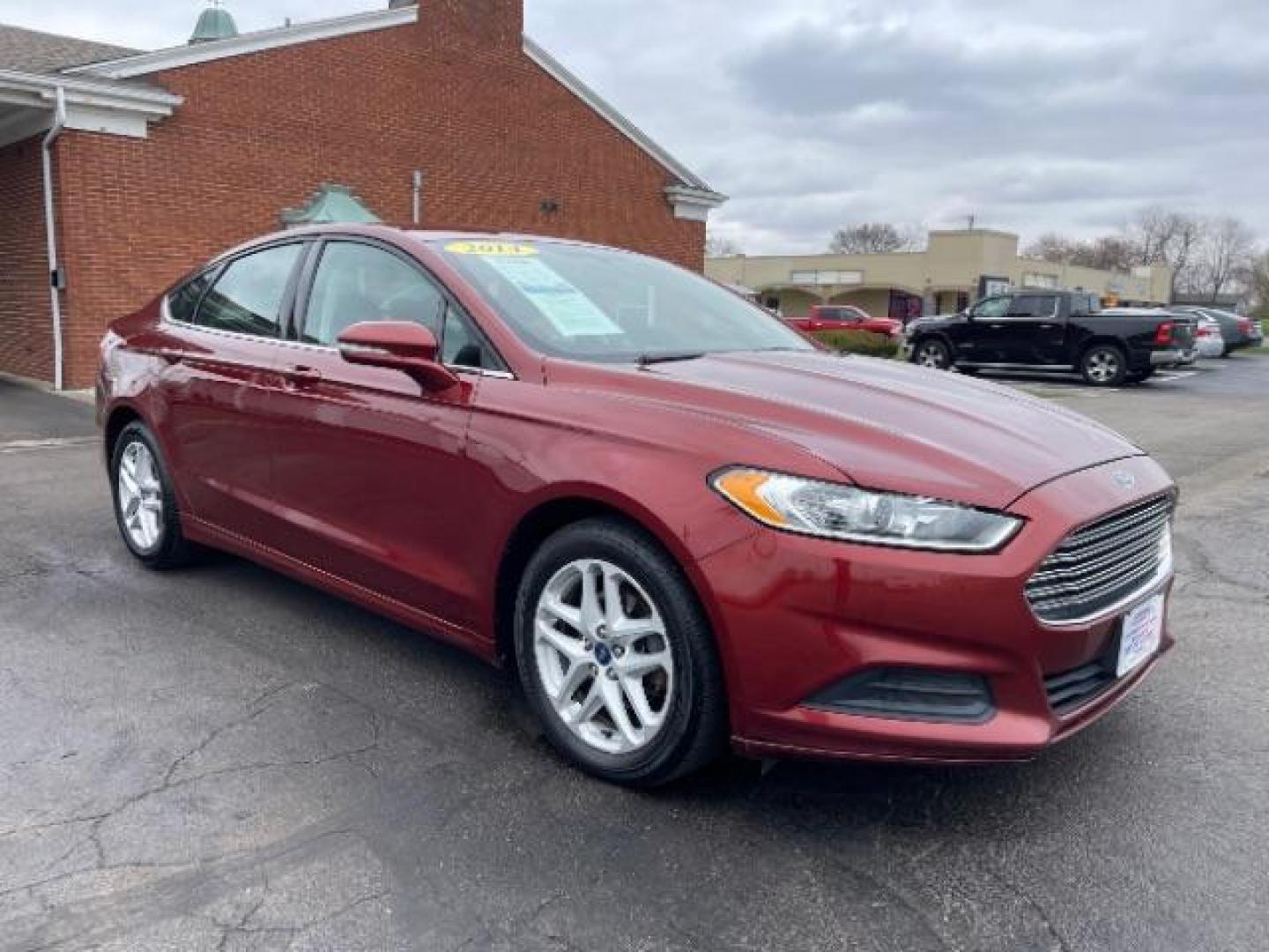 2014 Ruby Red Met Tinted CC Ford Fusion SE (3FA6P0H74ER) with an 2.5L L4 DOHC 16V engine, located at 1099 N County Rd 25A , Troy, OH, 45373, (937) 908-9800, 40.057079, -84.212883 - Photo#0