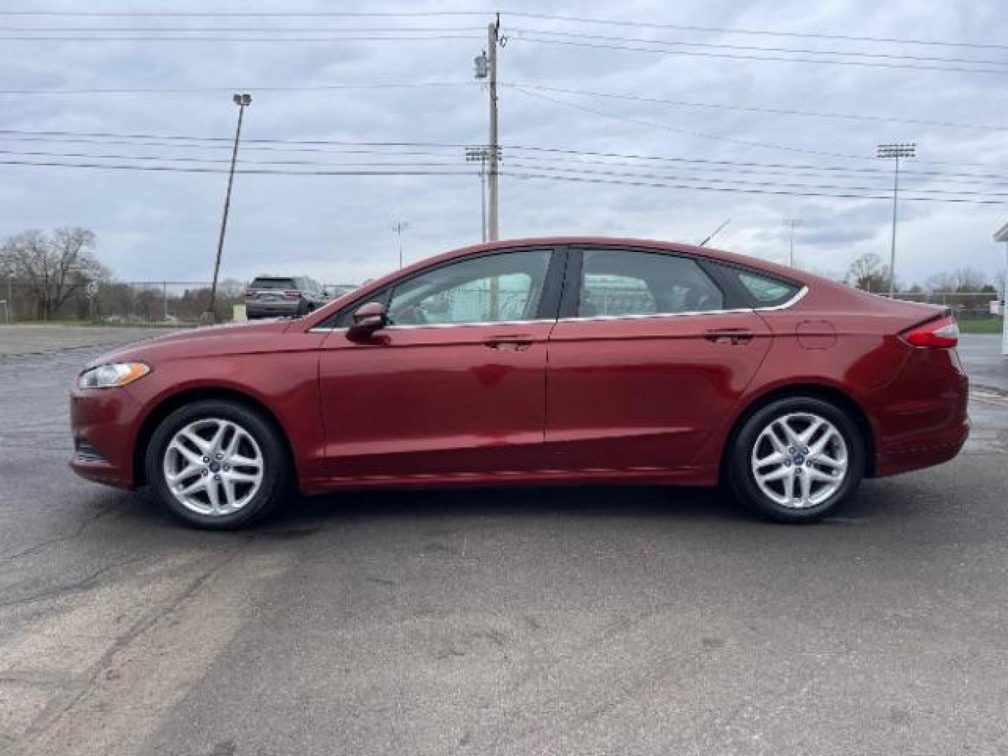 2014 Ruby Red Met Tinted CC Ford Fusion SE (3FA6P0H74ER) with an 2.5L L4 DOHC 16V engine, located at 1099 N County Rd 25A , Troy, OH, 45373, (937) 908-9800, 40.057079, -84.212883 - Photo#2