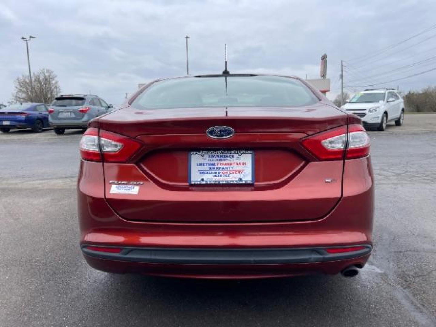 2014 Ruby Red Met Tinted CC Ford Fusion SE (3FA6P0H74ER) with an 2.5L L4 DOHC 16V engine, located at 1099 N County Rd 25A , Troy, OH, 45373, (937) 908-9800, 40.057079, -84.212883 - Photo#5