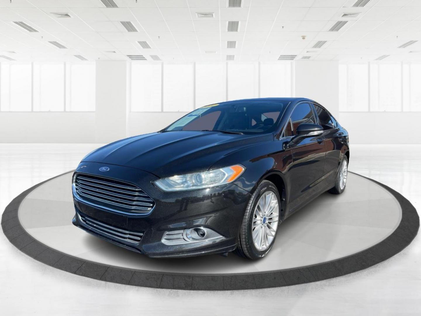 2014 Tuxedo Black Metallic Ford Fusion SE (3FA6P0H93ER) with an 2.0L L4 DOHC 16V engine, located at 1184 Kauffman Ave, Fairborn, OH, 45324, (937) 908-9800, 39.807072, -84.030914 - Photo#7