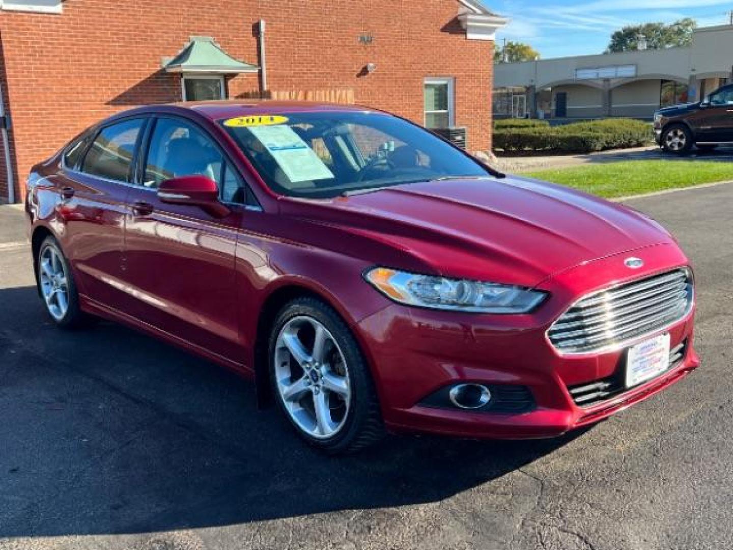 2014 Ruby Red Met Tinted CC Ford Fusion SE (3FA6P0H77ER) with an 2.5L L4 DOHC 16V engine, located at 1184 Kauffman Ave, Fairborn, OH, 45324, (937) 908-9800, 39.807072, -84.030914 - Photo#0