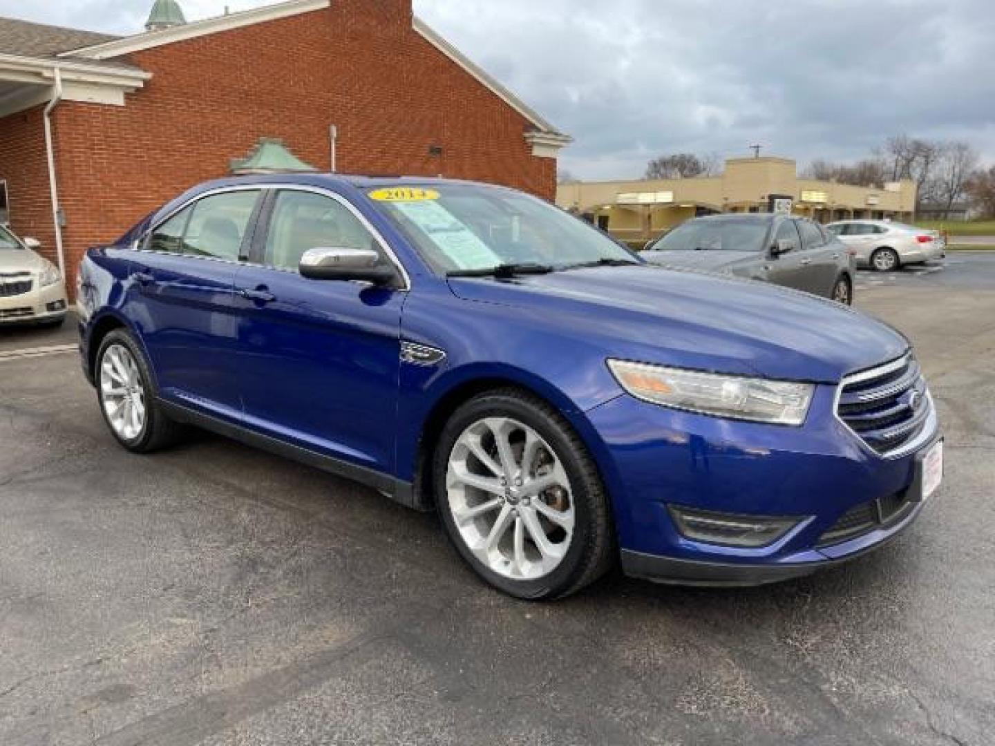 2014 Deep Impact Blue Metallic Ford Taurus Limited AWD (1FAHP2J86EG) with an 3.5L V6 DOHC 24V engine, 6-Speed Automatic transmission, located at 1230 East Main St, Xenia, OH, 45385, (937) 908-9800, 39.688026, -83.910172 - Photo#0