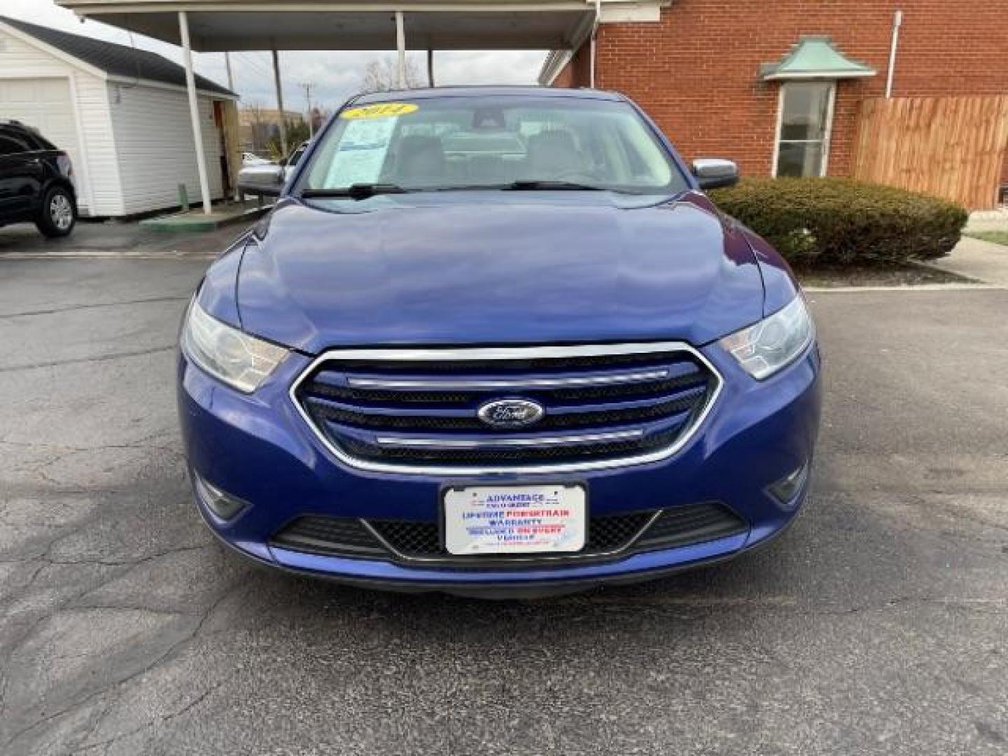 2014 Deep Impact Blue Metallic Ford Taurus Limited AWD (1FAHP2J86EG) with an 3.5L V6 DOHC 24V engine, 6-Speed Automatic transmission, located at 1230 East Main St, Xenia, OH, 45385, (937) 908-9800, 39.688026, -83.910172 - Photo#2