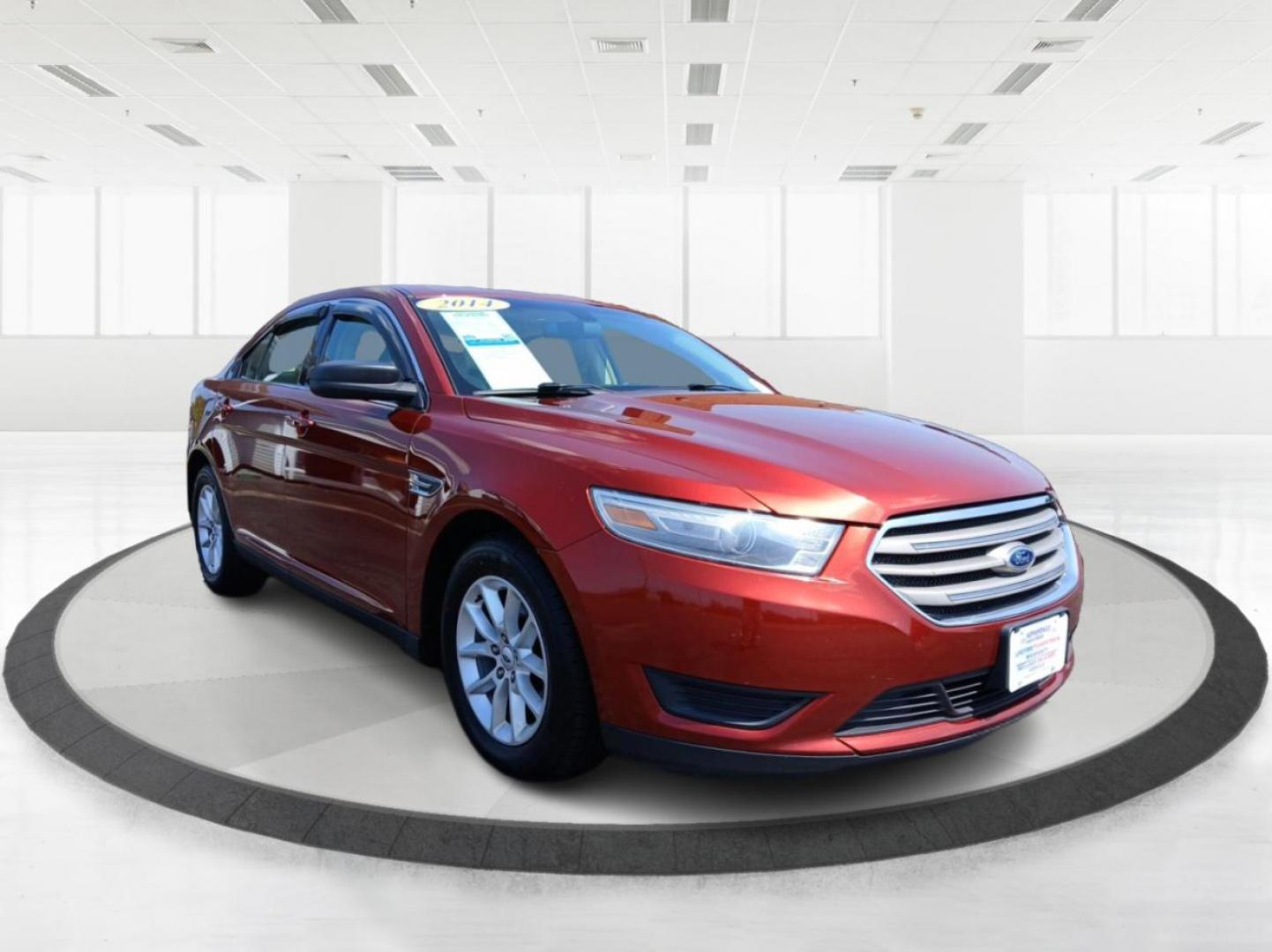 2014 Sunset Metallic Ford Taurus SE FWD (1FAHP2D88EG) with an 3.5L V6 DOHC 24V engine, 6-Speed Automatic transmission, located at 880 E. National Road, Vandalia, OH, 45377, (937) 908-9800, 39.891918, -84.183594 - Photo#0