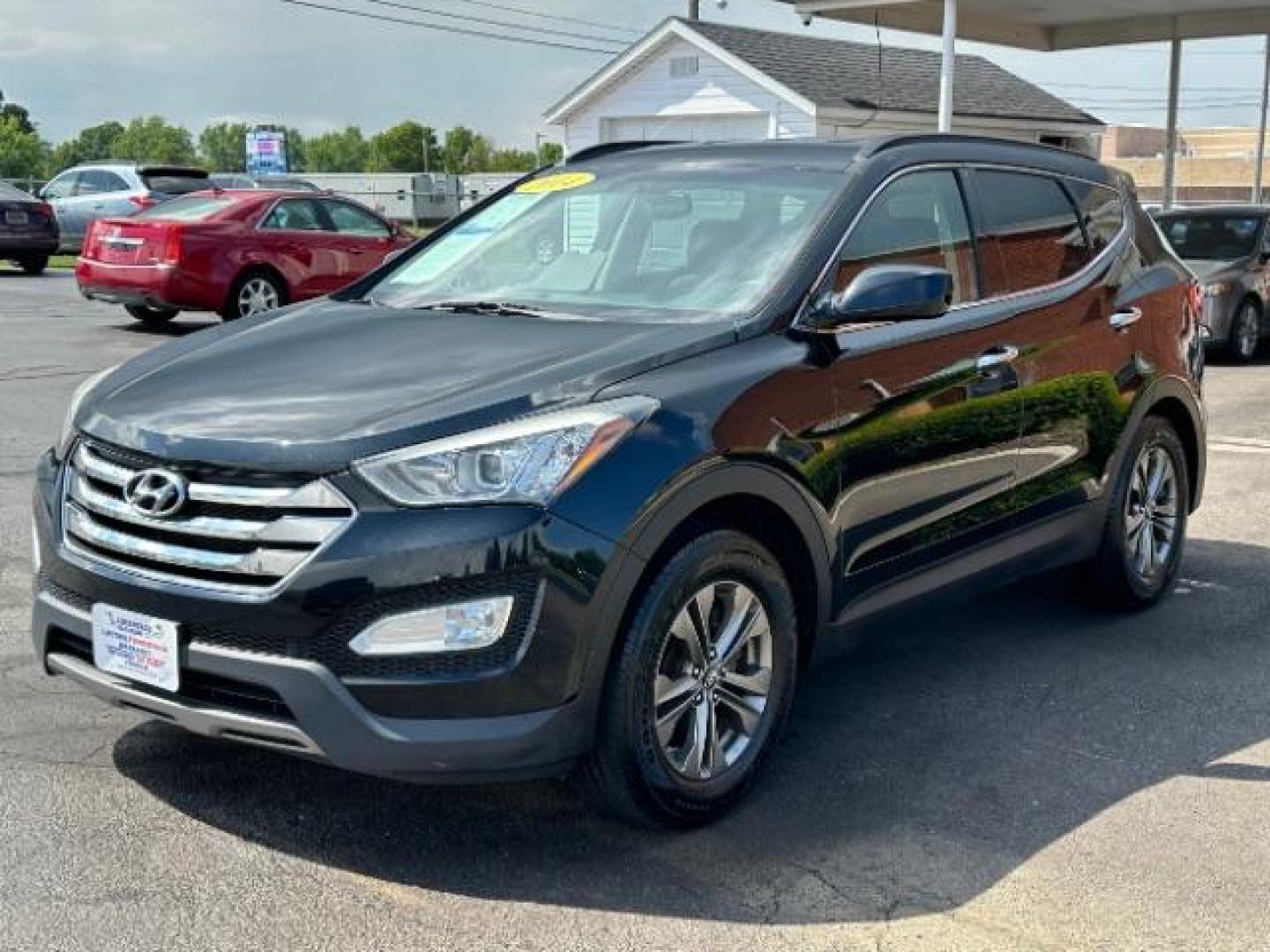 2014 Twilight Black Hyundai Santa Fe Sport 2.4 FWD (5XYZU3LB4EG) with an 2.4L L4 DOHC 16V engine, 6-Speed Automatic transmission, located at 401 Woodman Dr, Riverside, OH, 45431, (937) 908-9800, 39.760899, -84.123421 - Photo#2