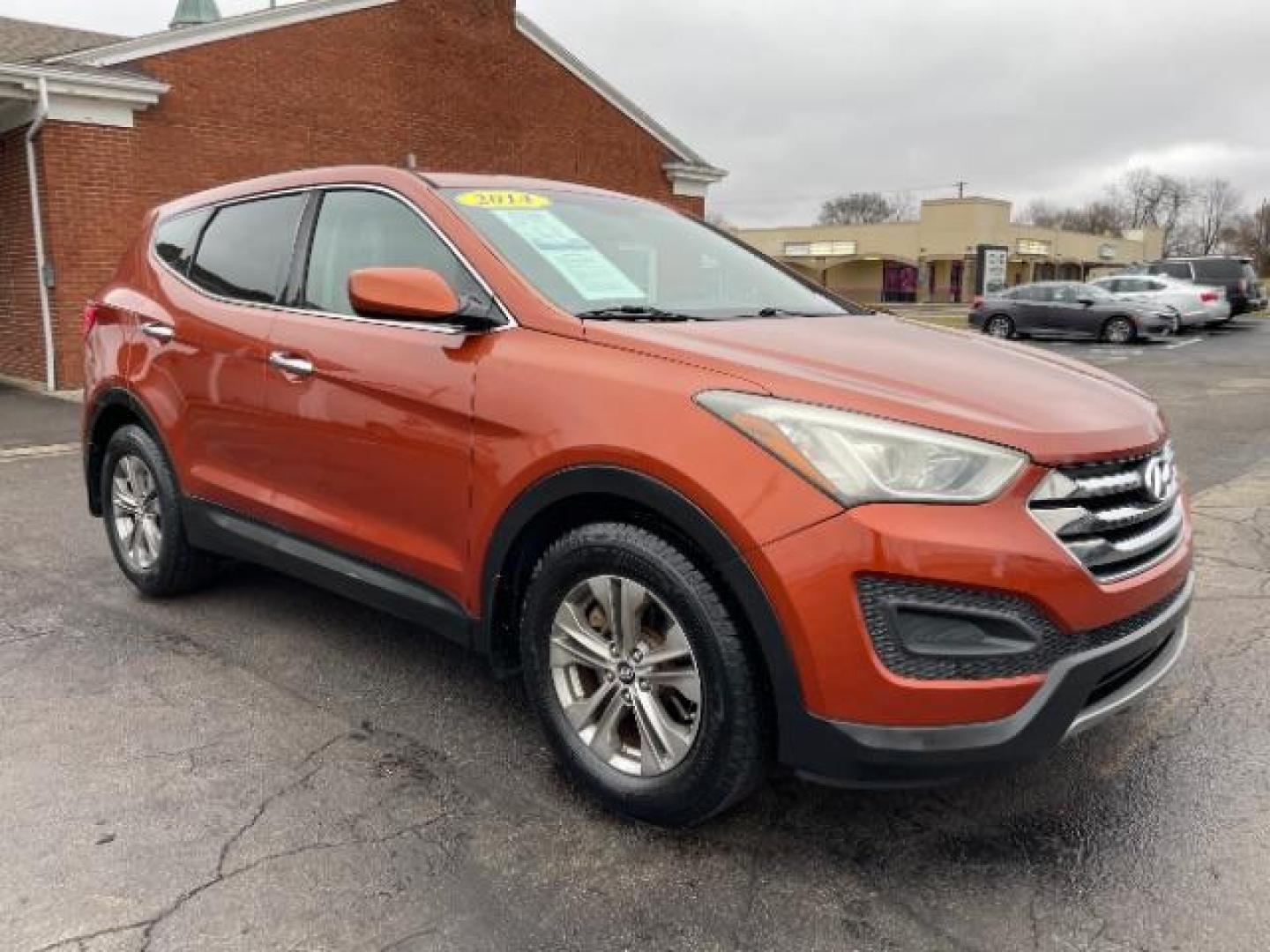 2014 Canyon Copper Hyundai Santa Fe Sport 2.4 FWD (5XYZT3LB1EG) with an 2.4L L4 DOHC 16V engine, 6-Speed Automatic transmission, located at 1184 Kauffman Ave, Fairborn, OH, 45324, (937) 908-9800, 39.807072, -84.030914 - Photo#0