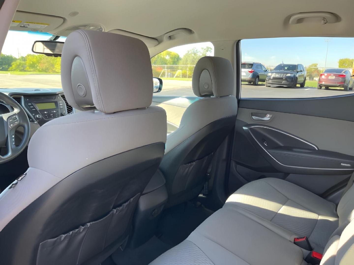 2014 Moonstone Silver Hyundai Santa Fe (5XYZTDLB2EG) with an 2.4L L4 DOHC 16V engine, 6-Speed Automatic transmission, located at 1099 N County Rd 25A , Troy, OH, 45373, (937) 908-9800, 40.057079, -84.212883 - Photo#9