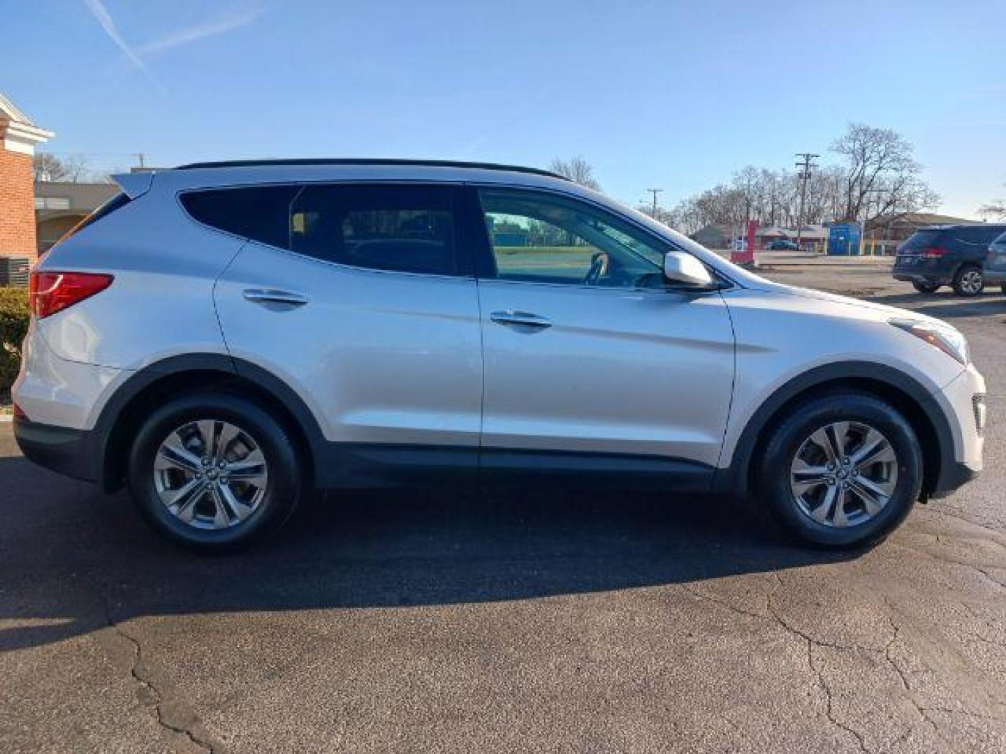 2014 Hyundai Santa Fe Sport 2.4 FWD (5XYZU3LB3EG) with an 2.4L L4 DOHC 16V engine, 6-Speed Automatic transmission, located at 1951 S Dayton Lakeview Rd., New Carlisle, OH, 45344, (937) 908-9800, 39.890999, -84.050255 - 2014 Hyundai Santa Fe Sport 2.4 FWD - Photo#4