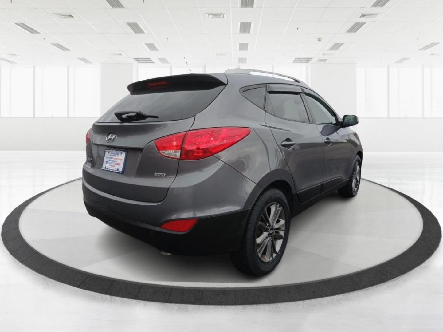 2014 Hyundai Tucson GLS AWD (KM8JUCAGXEU) with an 2.4L L4 DOHC 16V engine, 6-Speed Automatic transmission, located at 1951 S Dayton Lakeview Rd., New Carlisle, OH, 45344, (937) 908-9800, 39.890999, -84.050255 - 2014 Hyundai Tucson GLS AWD - Photo#2