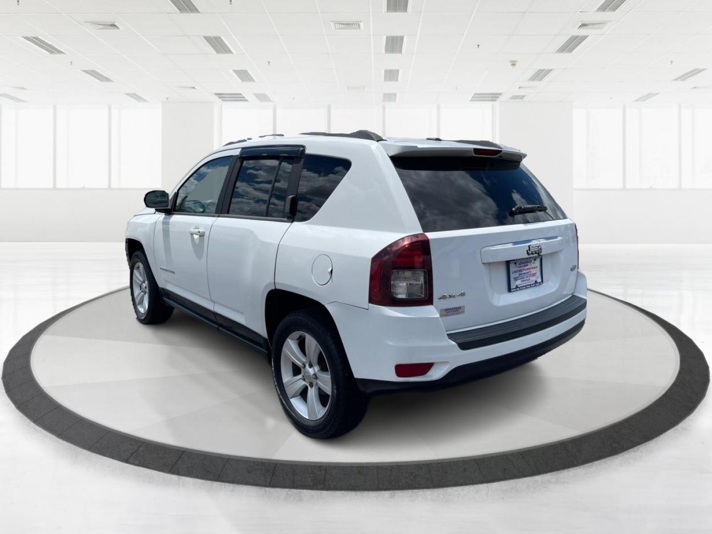 2014 Bright White Clearcoat Jeep Compass Latitude 4WD (1C4NJDEB8ED) with an 2.4L L4 DOHC 16V engine, Continuously Variable Transmission transmission, located at 1099 N County Rd 25A , Troy, OH, 45373, (937) 908-9800, 40.057079, -84.212883 - Photo#4