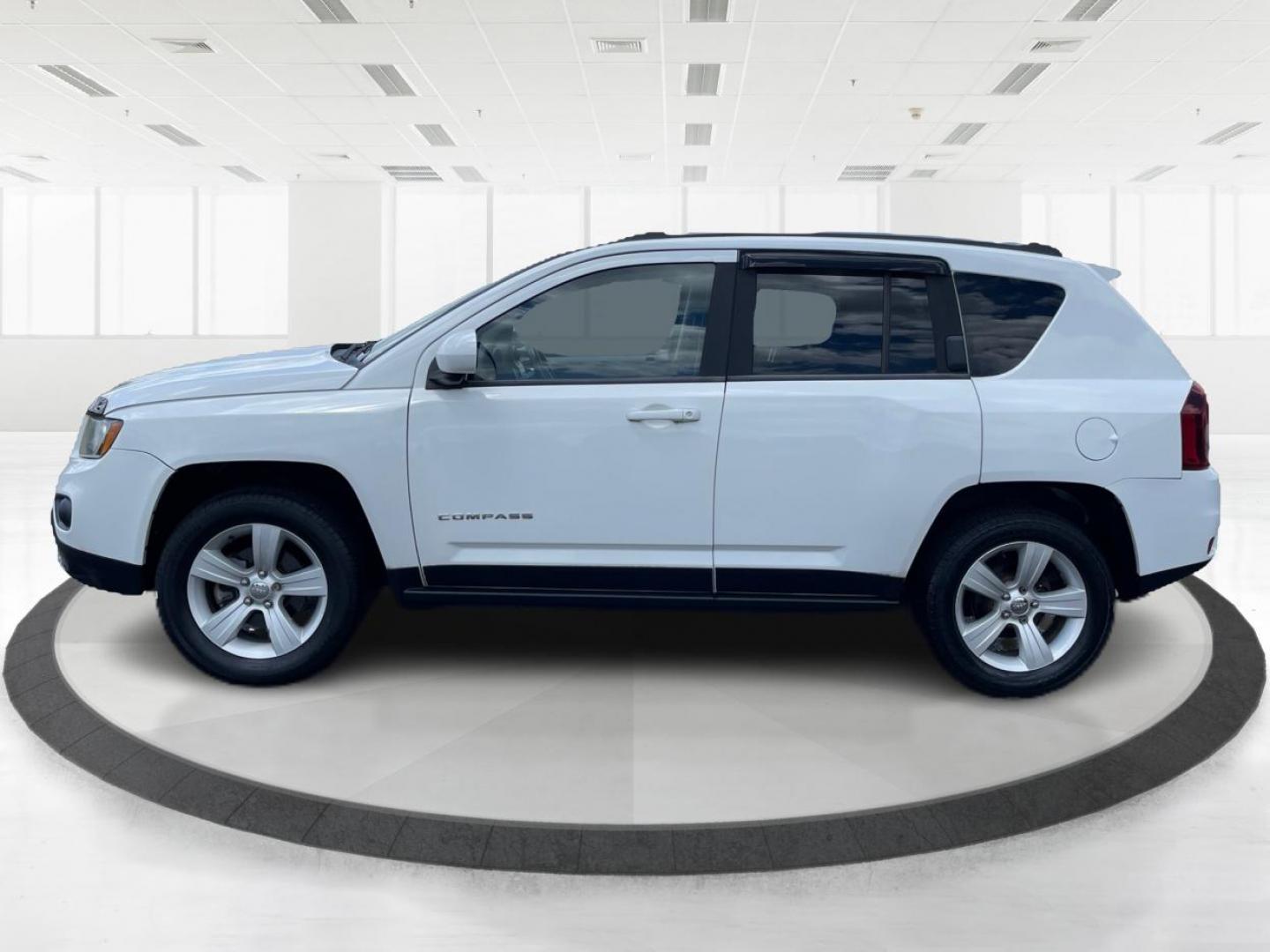 2014 Bright White Clearcoat Jeep Compass Latitude 4WD (1C4NJDEB8ED) with an 2.4L L4 DOHC 16V engine, Continuously Variable Transmission transmission, located at 1099 N County Rd 25A , Troy, OH, 45373, (937) 908-9800, 40.057079, -84.212883 - Photo#5