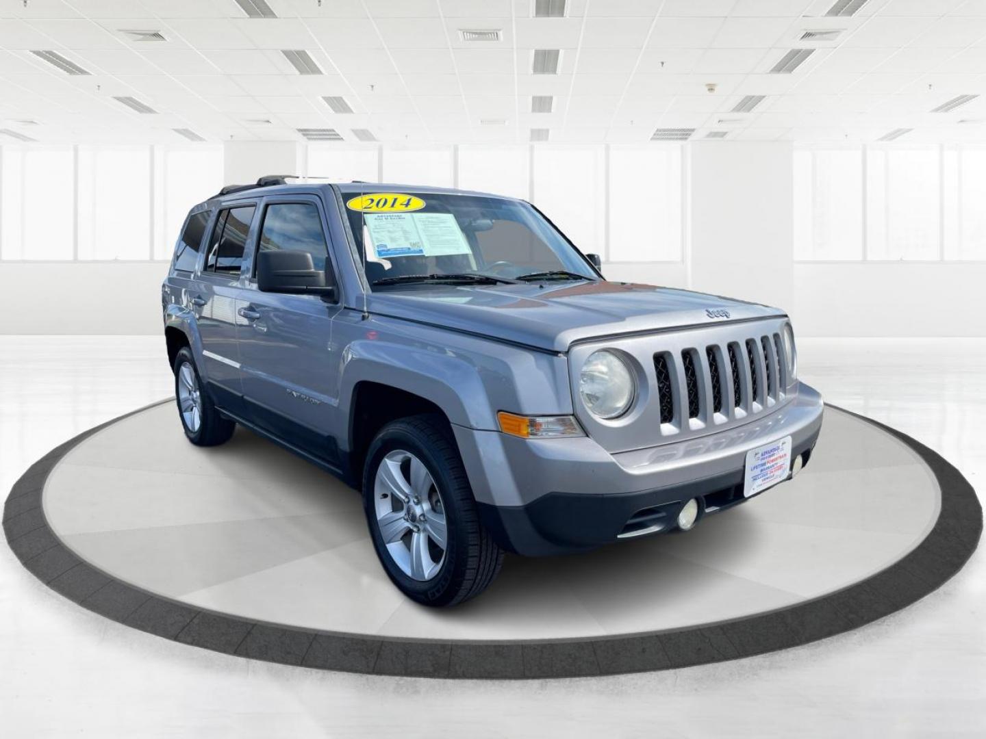 2014 Bright Silver Metallic CC Jeep Patriot Latitude 4WD (1C4NJRFB2ED) with an 2.4L L4 DOHC 16V engine, located at 1951 S Dayton Lakeview Rd., New Carlisle, OH, 45344, (937) 908-9800, 39.890999, -84.050255 - Photo#0