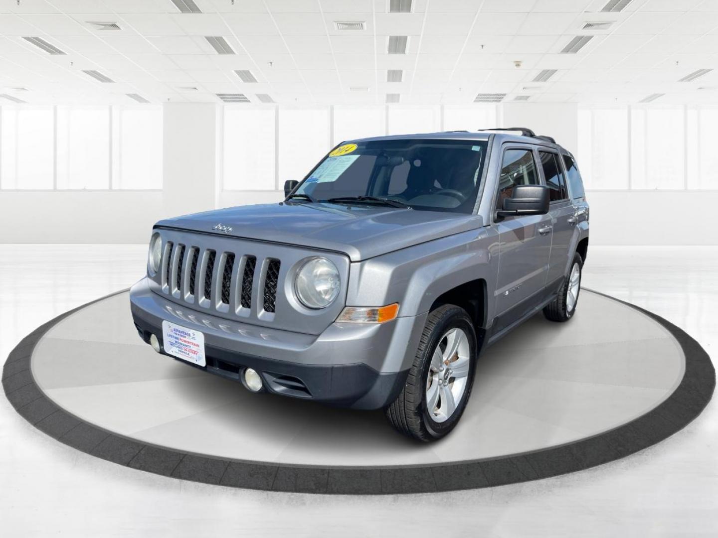 2014 Bright Silver Metallic CC Jeep Patriot Latitude 4WD (1C4NJRFB2ED) with an 2.4L L4 DOHC 16V engine, located at 1951 S Dayton Lakeview Rd., New Carlisle, OH, 45344, (937) 908-9800, 39.890999, -84.050255 - Photo#7