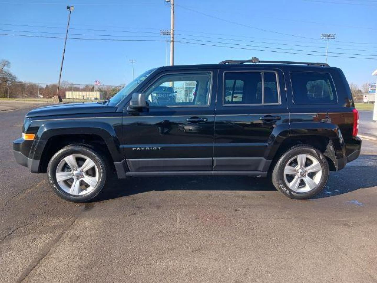 2014 Black Clearcoat Jeep Patriot Latitude 4WD (1C4NJRFB8ED) with an 2.4L L4 DOHC 16V engine, located at 401 Woodman Dr, Riverside, OH, 45431, (937) 908-9800, 39.760899, -84.123421 - Photo#3