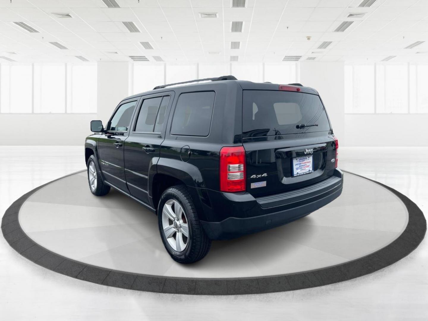 2014 Black Clearcoat Jeep Patriot Latitude 4WD (1C4NJRFB1ED) with an 2.4L L4 DOHC 16V engine, located at 880 E. National Road, Vandalia, OH, 45377, (937) 908-9800, 39.891918, -84.183594 - Photo#4