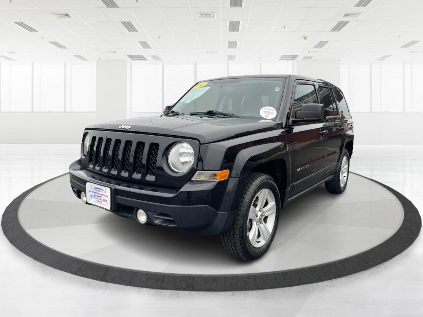 2014 Black Clearcoat Jeep Patriot Latitude 4WD (1C4NJRFB1ED) with an 2.4L L4 DOHC 16V engine, located at 880 E. National Road, Vandalia, OH, 45377, (937) 908-9800, 39.891918, -84.183594 - Photo#7