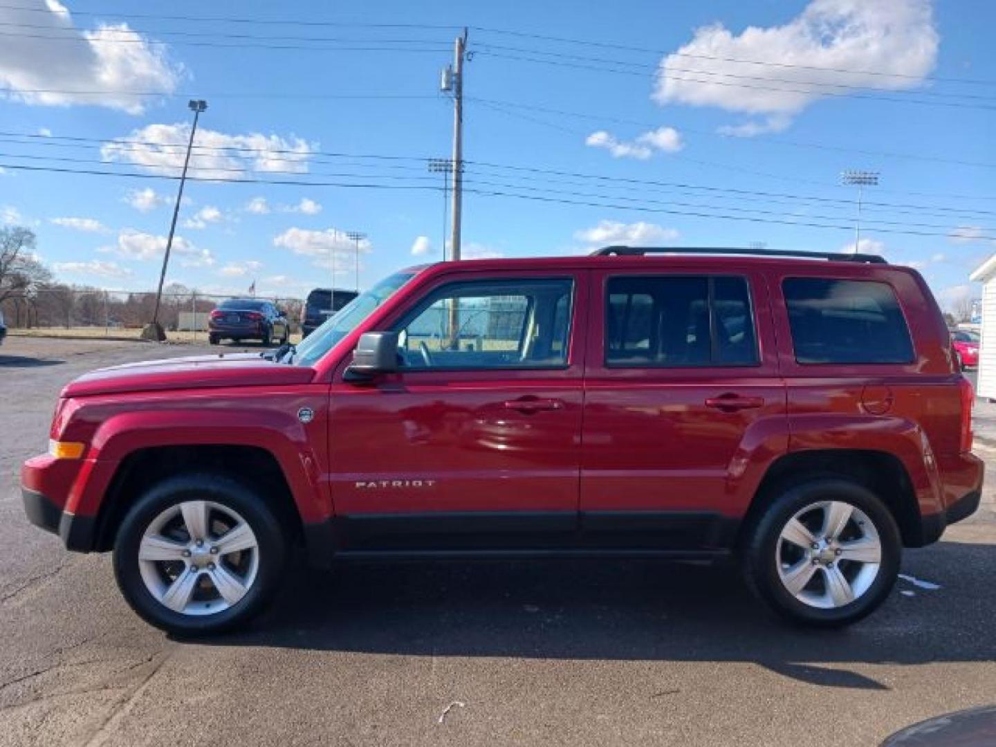 2014 Dp Cherry Red Crystal PC Jeep Patriot (1C4NJRFB0ED) with an 2.4L L4 DOHC 16V engine, located at 401 Woodman Dr, Riverside, OH, 45431, (937) 908-9800, 39.760899, -84.123421 - Photo#12